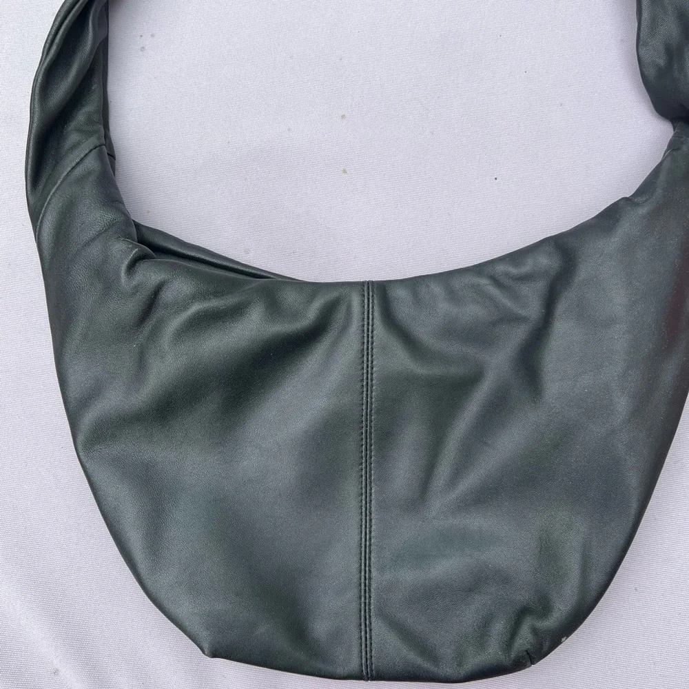 Maje “le bow bag” in black leather with silver studs
